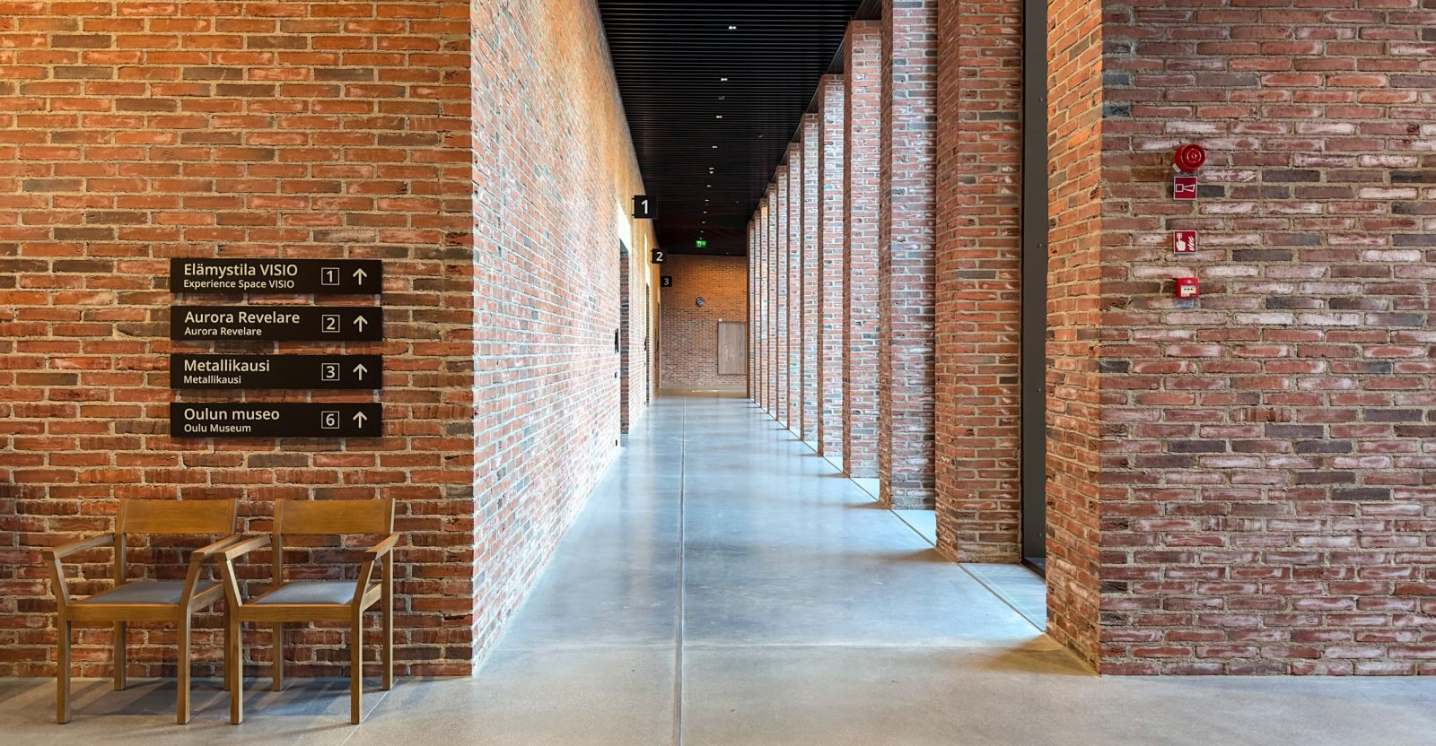 Tiima’s accessible corridor and signage to the exhibition spaces.